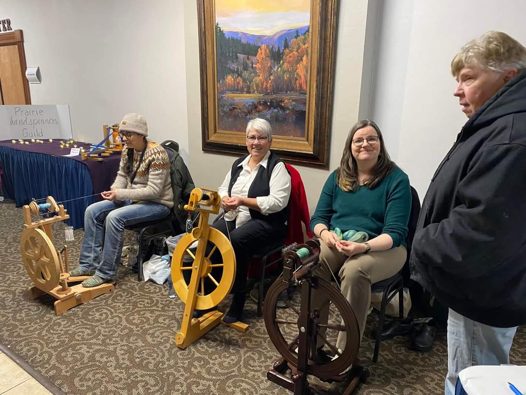 RMA’s Karen Korenko (right) gives a live demonstration of hand spinning wool at the Annual Montana Wool Growers Convention.